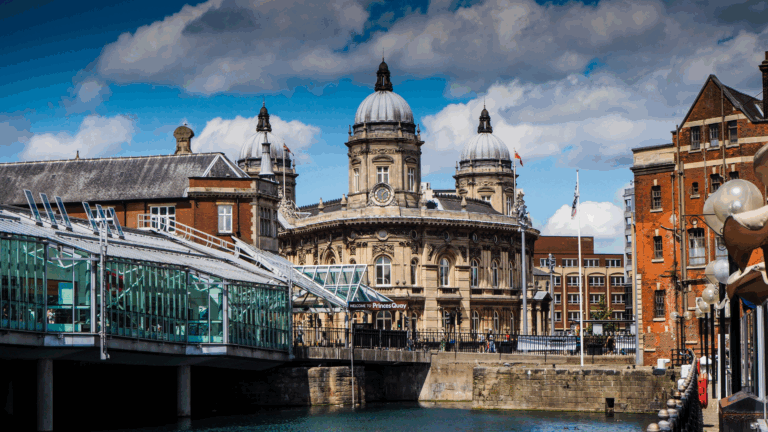 A wide shot of Hull's impressive old town buildings, including the Maritime Museum, with a modern footbridge in the foreground.